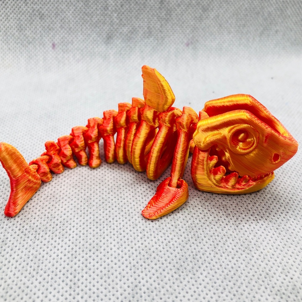 3D print toys 
Orange Fish Skeleton Aquarium Ornament - Decorative Fish Bone